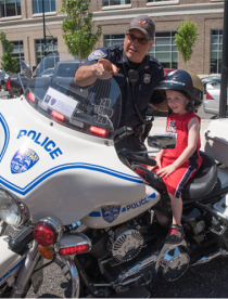  Motorcycle police with child